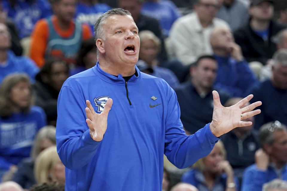 Creighton head coach Greg McDermott calls out to his team during the first half of a college basketball game against Akron in the first round of the NCAA men's tournament Thursday, March 21, 2024, in Pittsburgh. (AP Photo/Matt Freed)