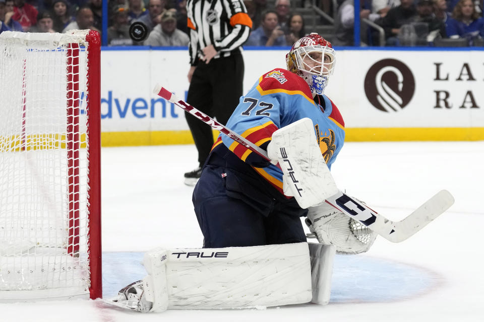 Florida Panthers goaltender Sergei Bobrovsky (72) makes a save on a shot by the Tampa Bay Lightning during the second period of an NHL hockey game Saturday, Dec. 10, 2022, in Tampa, Fla. (AP Photo/Chris O'Meara)