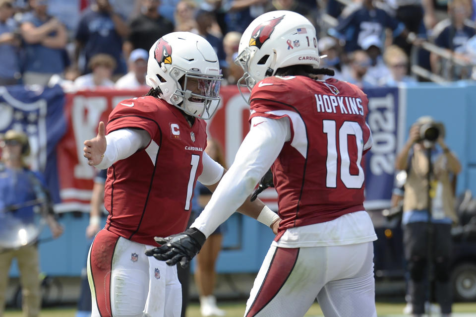 Arizona Cardinals quarterback Kyler Murray (1) is congratulated by wide receiver DeAndre Hopkins (10) after Murray ran for a touchdown against the Tennessee Titans in the first half of an NFL football game Sunday, Sept. 12, 2021, in Nashville, Tenn. (AP Photo/Mark Zaleski)