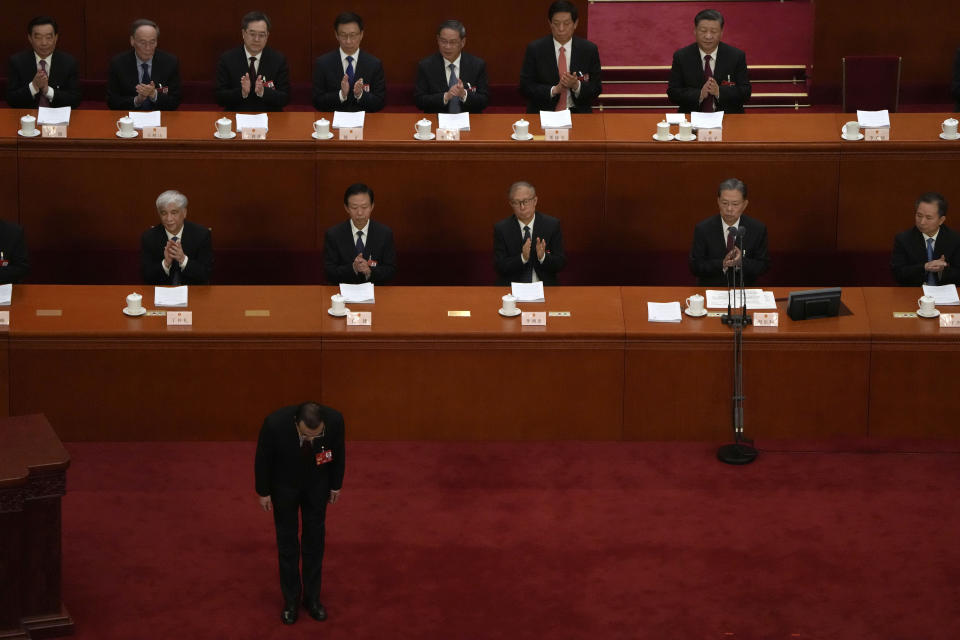 Chinese Premier Li Keqiang bows before speaking during the opening session of China's National People's Congress (NPC) at the Great Hall of the People in Beijing, Sunday, March 5, 2023. (AP Photo/Ng Han Guan)