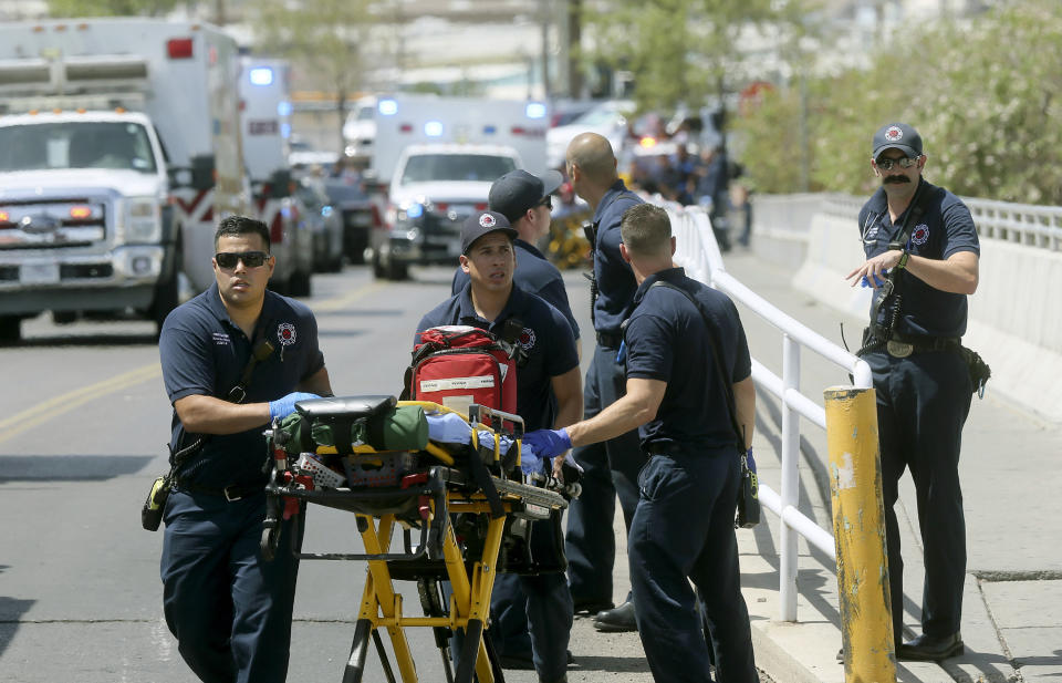 FILE - In this Aug. 3, 2019 file photo, El Paso Fire Medical personnel arrive at the scene of a shooting at a Walmart near the Cielo Vista Mall in El Paso, Texas. The FBI has labeled two of those attacks, at the Texas Walmart and California food festival, as domestic terrorism — acts meant to intimidate or coerce a civilian population and affect government policy. But the bureau hasn't gone that far with a shooting at an Ohio entertainment district. (Mark Lambie/The El Paso Times via AP, File)