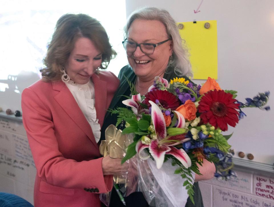 Santa Rosa County Superintendent of Schools Karen Barber congratulates Navarre High School teacher Karen Cody on being named the district Teacher of the Year on Wednesday, Jan. 25, 2023