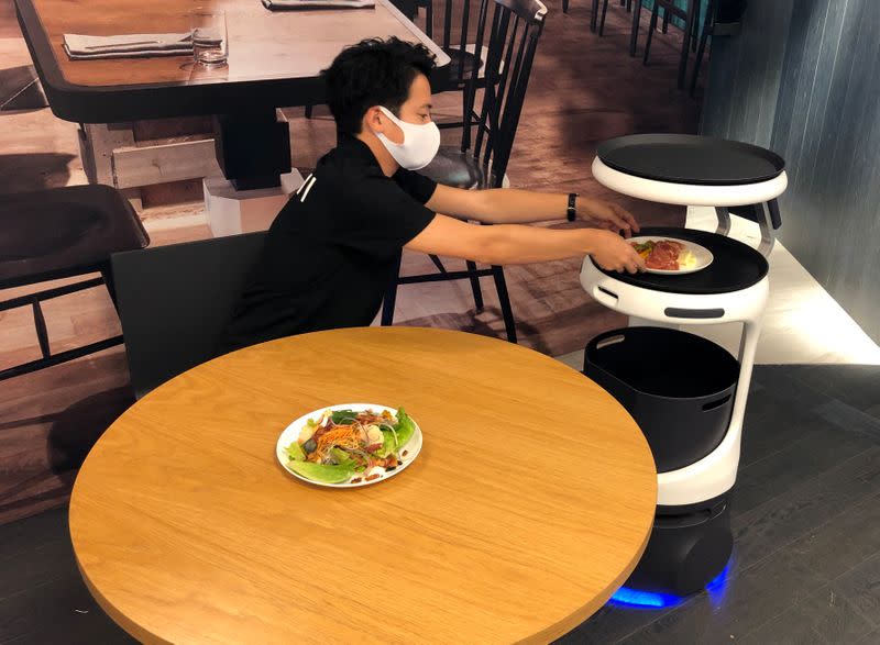 SoftBank's robotics arm demonstrates a food service robot Servi, developed for restaurants grapple with labour shortages and seek to ensure social distancing during the coronavirus disease (COVID-19) outbreak, in T