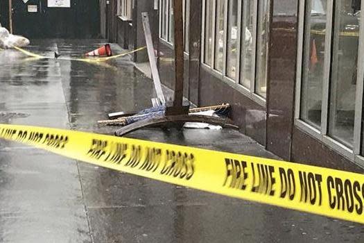 Police say a British tourist was injured and taken to the hospital when the hammock fell from the building: AP