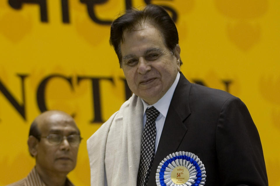 FILE - In this Sept. 2, 2008, file photo, veteran Bollywood actor Dilip Kumar, right, receives a Lifetime Achievement award at the 54th National Film Award ceremony in New Delhi, India. Kumar, hailed as the “Tragedy King” and one of Hindi cinema's greatest actors, died Wednesday, July 7, 2021 in a Mumbai hospital after a prolonged illness. He was 98. (AP Photo/Gurinder Osan, File)