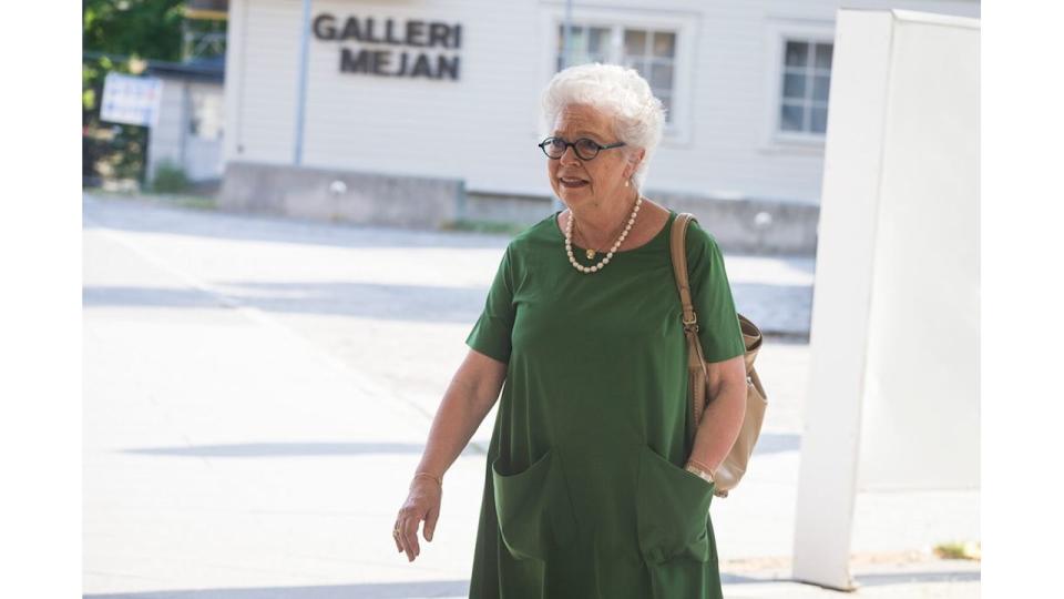 Princess Christina in a green dress and pearl necklace