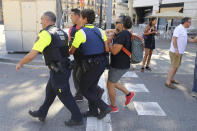 <p>An injured person is carried in Barcelona, Spain, Aug. 17, 2017 after a white van jumped the sidewalk in the historic Las Ramblas district, crashing into a summer crowd of residents and tourists and injuring several people, police said. (Oriol Duran/AP) </p>
