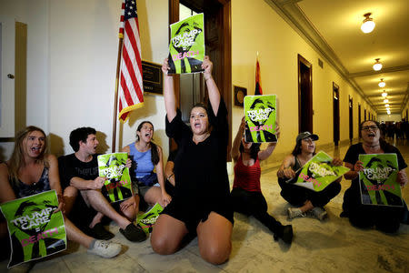 Healthcare activists protest to stop the Republican health care bill at Russell Senate Office Building on Capitol Hill in Washington. REUTERS/Yuri Gripas