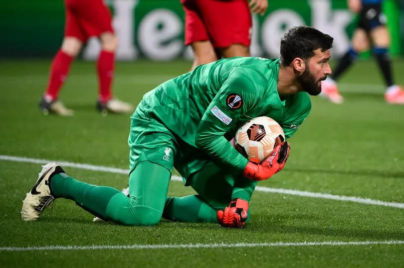 Alisson Becker of Liverpool FC makes a save during the UEFA Europa League 2023/24 Quarter-Final second leg match between Atalanta and Liverpool FC at Stadio Atleti Azzurri d'Italia on April 18, 2024 in Bergamo, Italy.