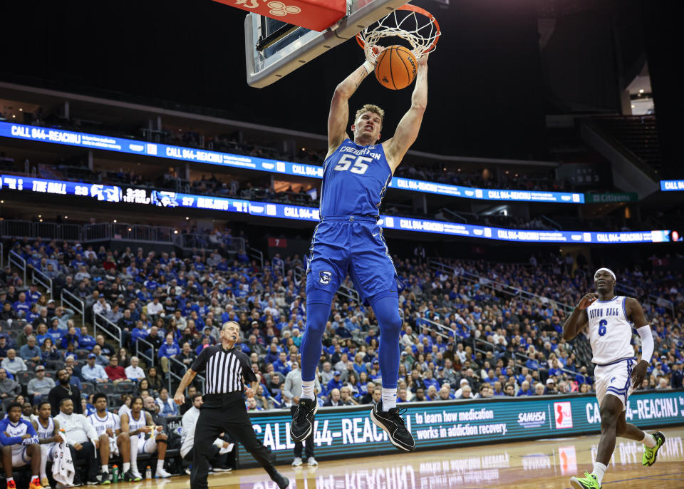 Jan 20, 2024; Newark, New Jersey, USA; Creighton Bluejays guard Baylor Scheierman (55) dunks the ball in front of Seton Hall Pirates forward David Tubek (6) during the first half at Prudential Center. Mandatory Credit: Vincent Carchietta-USA TODAY Sports
