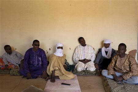 Toubou migrant smugglers sit in a living room in Agadez March 13, 2014. Picture taken March 13, 2014. REUTERS/Joe Penney