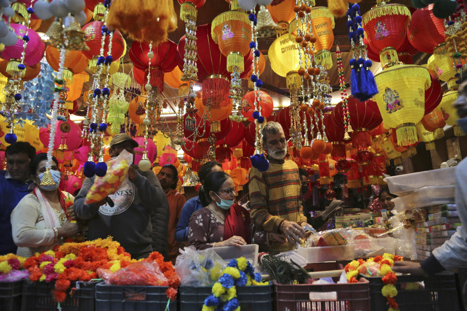 People crowd a market area on the eve of Diwali, the Hindu festival of lights, in Jammu, India, Wednesday, Nov. 3, 2021. Diwali is one of Hinduism's most important festivals, dedicated to the worship of the goddess of wealth Lakshmi. (AP Photo/Channi Anand)