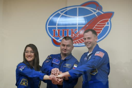 US astronauts Christina Koch (L) and Nick Hague (R) together with Russian colleague Alexey Ovchinin blasted off on a mission to the ISS