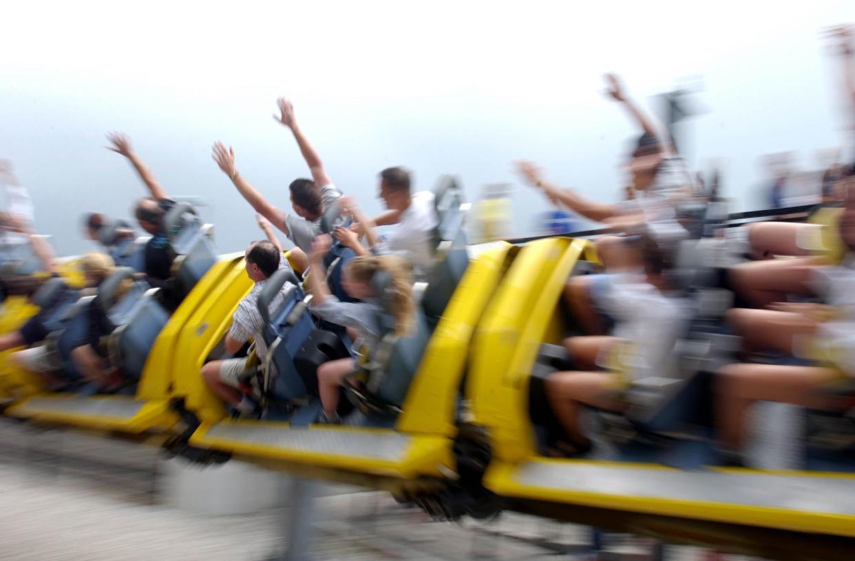 Riders fly by on the Millennium Force in July 2003, at Cedar Point Amusement Park in Sandusky, Ohio. Before the new Top Thrill Dragster appeared the Millennium Force claimed bragging rights as the world's tallest coaster.