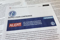 FILE - In this April 20, 2021, file photo, an alert from the Department of Homeland Security's Cybersecurity and Infrastructure Security Agency is photographed. Most Americans across party lines have serious concerns about cyber attacks on U.S. computer systems and view China and Russia as major threats. That's according to a new poll by The Pearson Institute and the Associated Press-NORC Center for Public Affairs Research (AP Photo/Jon Elswick)