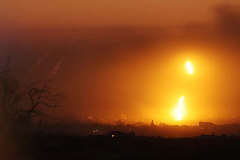 Rockets and 'light bombs' are seen fired towards Gaza on Monday from Sderot, Israel (Getty Images)