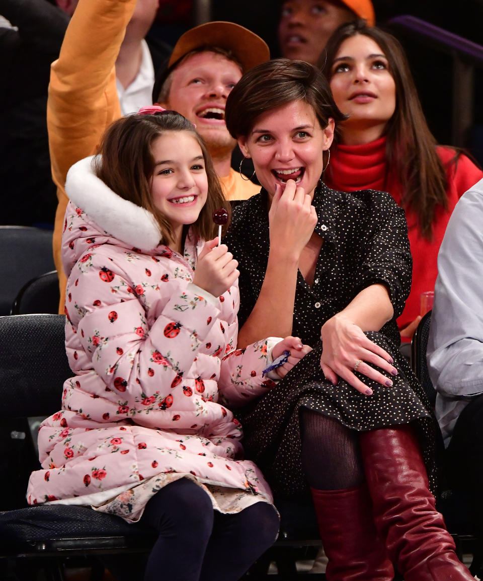 Suri Cruise and Katie Holmes attend an NBA game in 2017. (Photo: James Devaney via Getty Images)