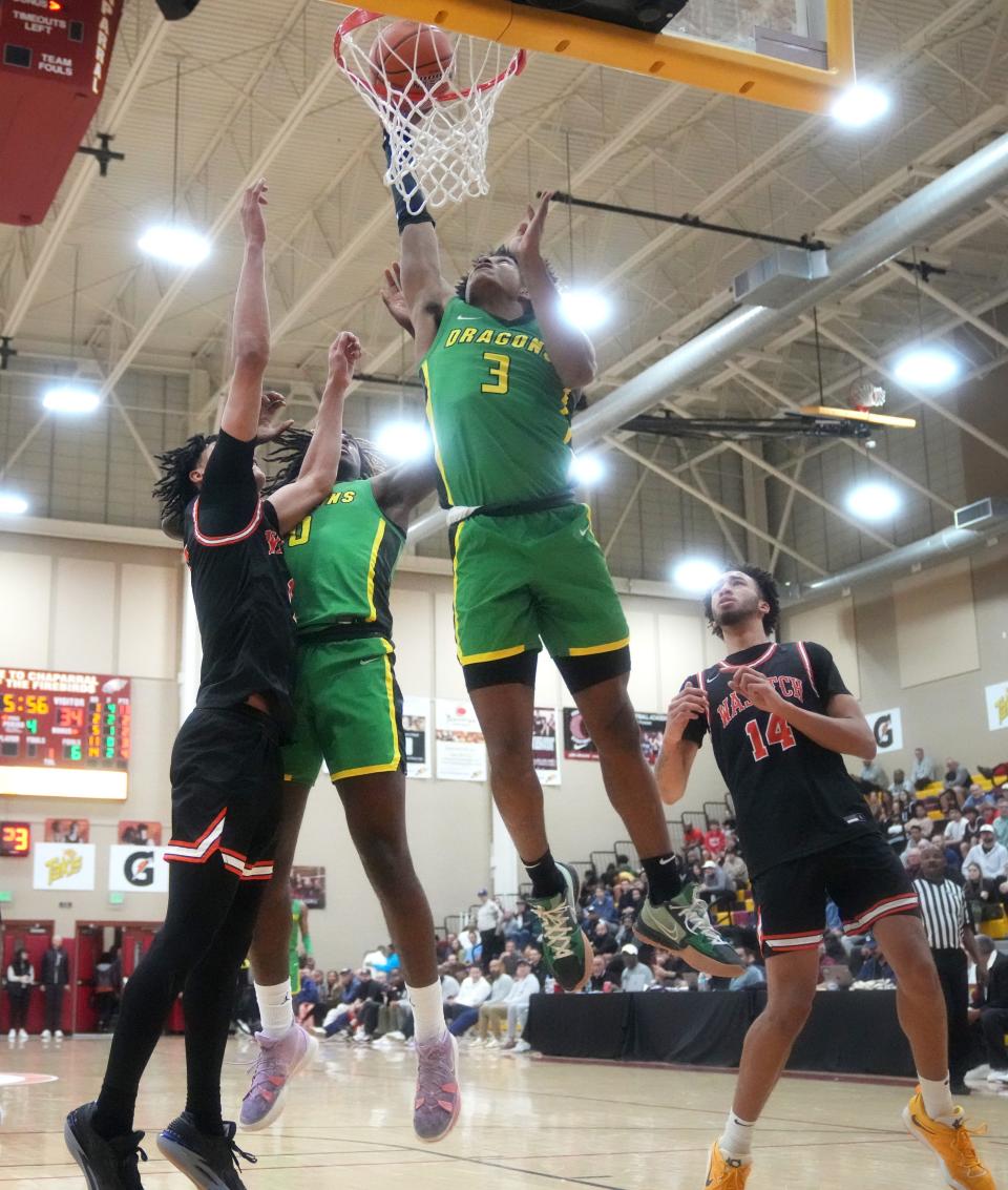 Dec 9, 2022; Scottsdale, AZ, USA; Compass Prep Dragons’ Tru Washington (3) attempts to tip in a shot against the Wasatch Academy Tigers at Chaparral High School. Mandatory Credit: Joe Rondone-Arizona Republic