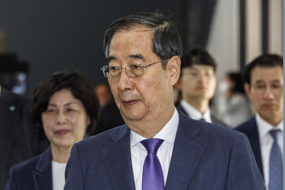 FILE - South Korean Prime Minster Han Duck-soo leaves after attending the commemoration ceremony for the 105th anniversary of the establishment of the Provisional Government of the Republic of Korea in Seoul, South Korea, Thursday, April 11, 2024. South Korean voters have handed liberals extended opposition control of parliament in what looks like a massive political setback to conservative President Yoon Suk Yeol. Some experts say the results of Wednesday’s parliamentary elections make Yoon “a lame duck” — or even “a dead duck” — for his remaining three years in office. Others disagree, saying Yoon still has many policy levers and could aggressively push his foreign policy agenda. (Hang Gwang-mo/Yonhap via AP, File)