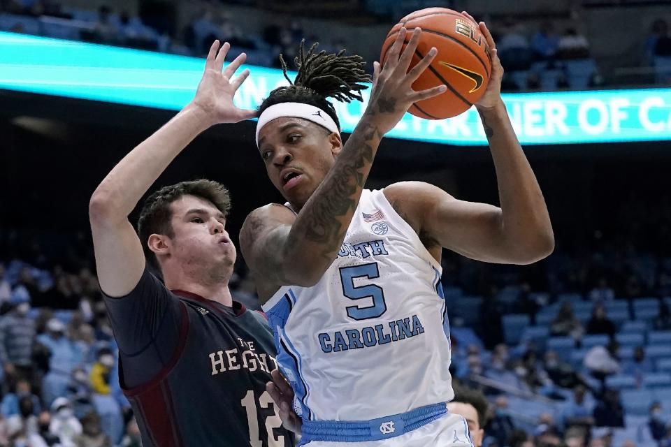 Boston College forward Quinten Post, left, bodies up on defense against North Carolina forward Armando Bacot during Wednesday night’s game.