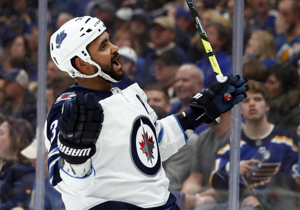 Winnipeg Jets' Dustin Byfuglien celebrates after scoring during the third period in Game 3 of an NHL first-round hockey playoff series against the St. Louis Blues Sunday, April 14, 2019, in St. Louis. The Jets won 6-3. (AP Photo/Jeff Roberson)