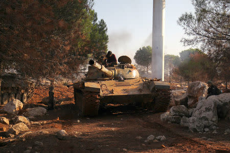 A rebel fighters' armoured vehicle drives n Dahiyet al-Assad, west Aleppo city, Syria October 30, 2016. REUTERS/Ammar Abdullah