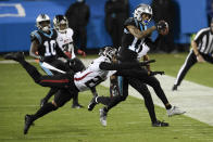 Carolina Panthers wide receiver Robby Anderson is tackled by Atlanta Falcons cornerback Isaiah Oliver during the first half of an NFL football game Thursday, Oct. 29, 2020, in Charlotte, N.C. (AP Photo/Mike McCarn)