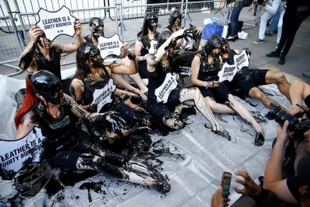 Activists from PETA stage a demonstration outside a venue during London Fashion Week in London