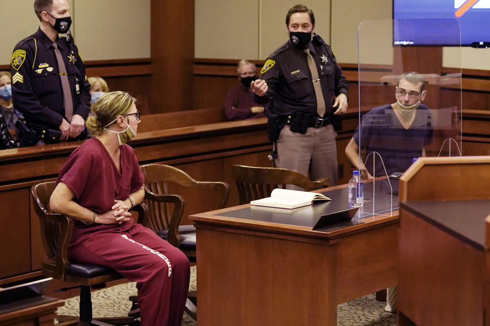 James Crumbley, right, looks towards his wife Jennifer Crumbley during a court hearing. Source: AP/Carlos Osorio, File