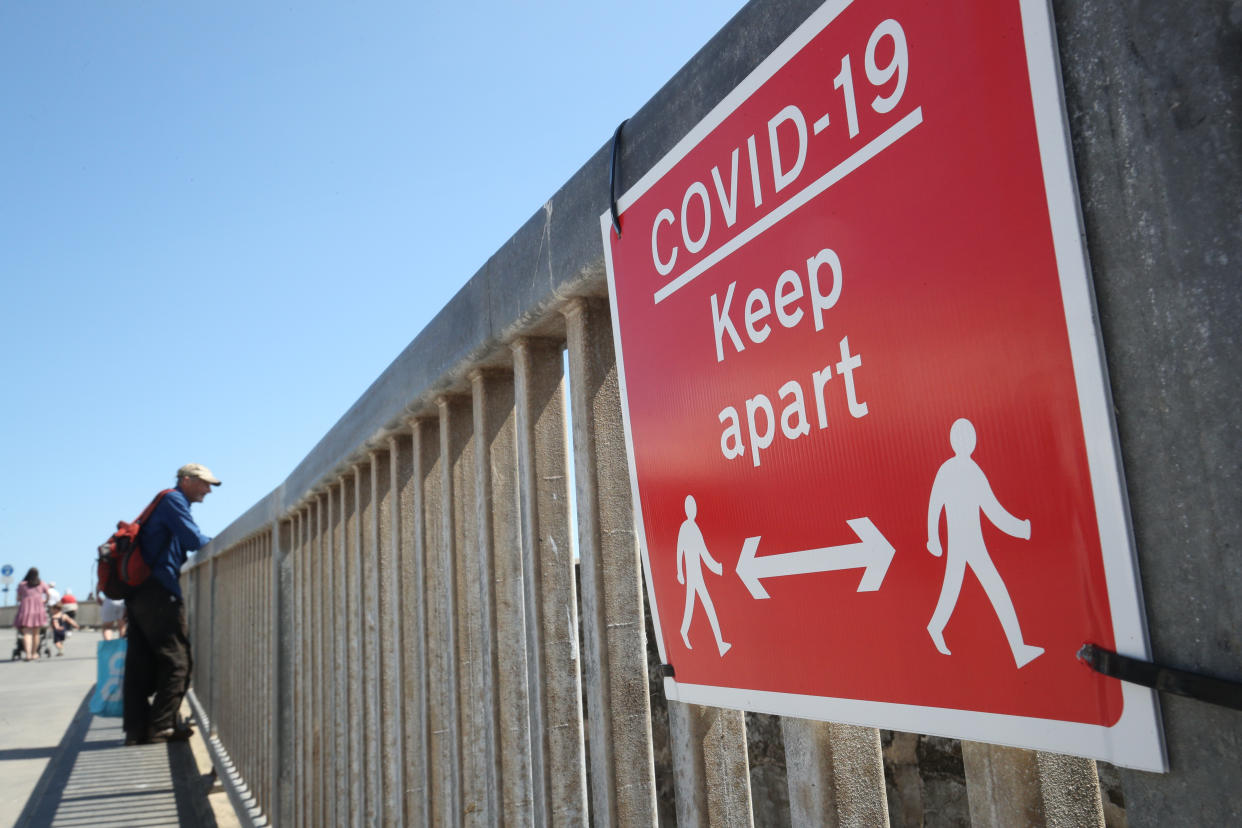 A coronavirus prevention sign in Bridlington, East Yorkshire, as Thursday could be the UK's hottest day of the year with scorching temperatures forecast to rise even further.