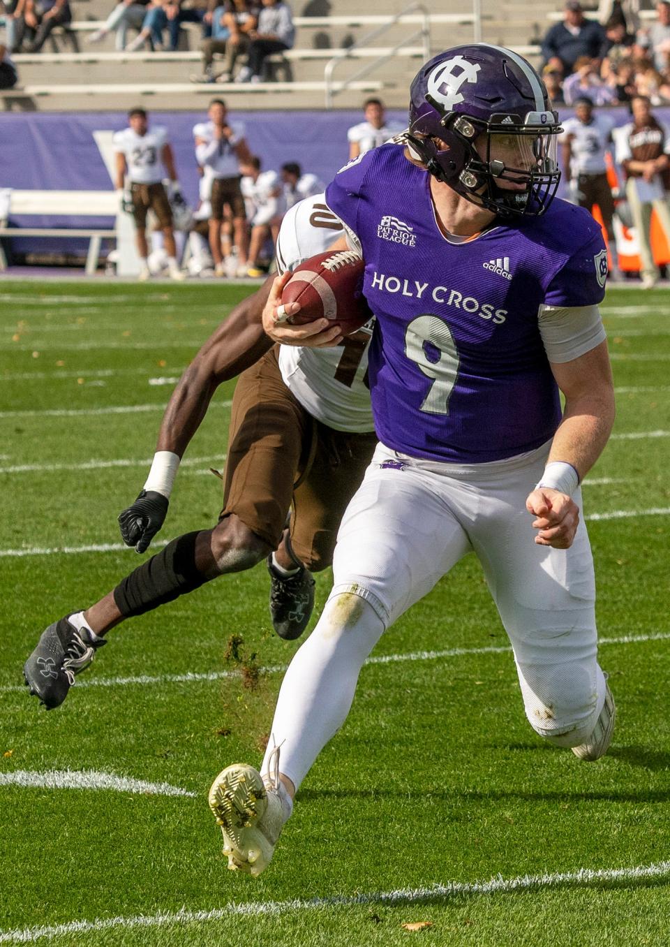 Holy Cross quarterback Matthew Sluka runs for a first down, setting up a first-quarter touchdown during Saturday's game against Lehigh at Fitton Field.