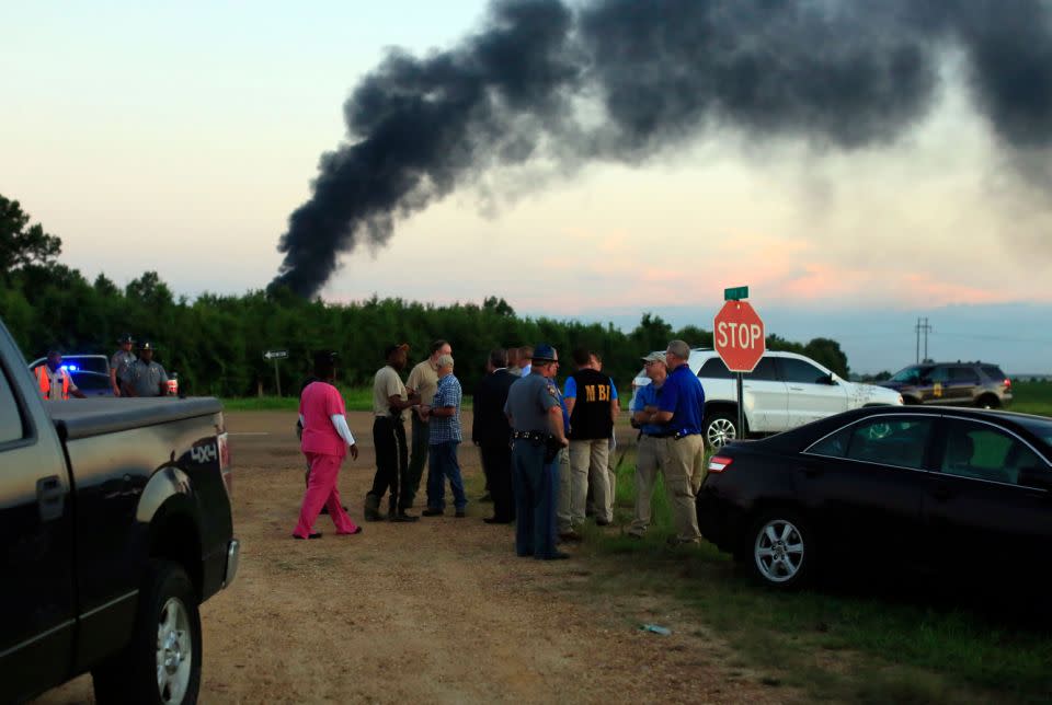 Emergency crews and officials gather at the crash site. Source: AAP