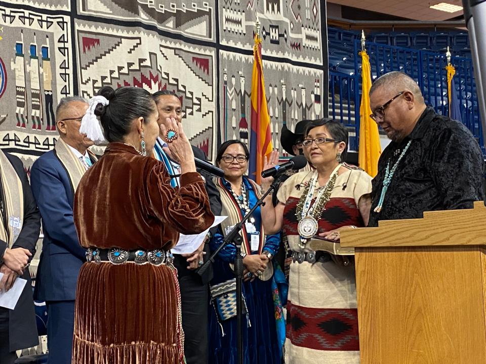 Navajo Nation Vice President Richelle Montoya takes her oath of office Tuesday as the first female vice president for the Navajo Nation, as her husband, Olsen Chee, stands beside her.