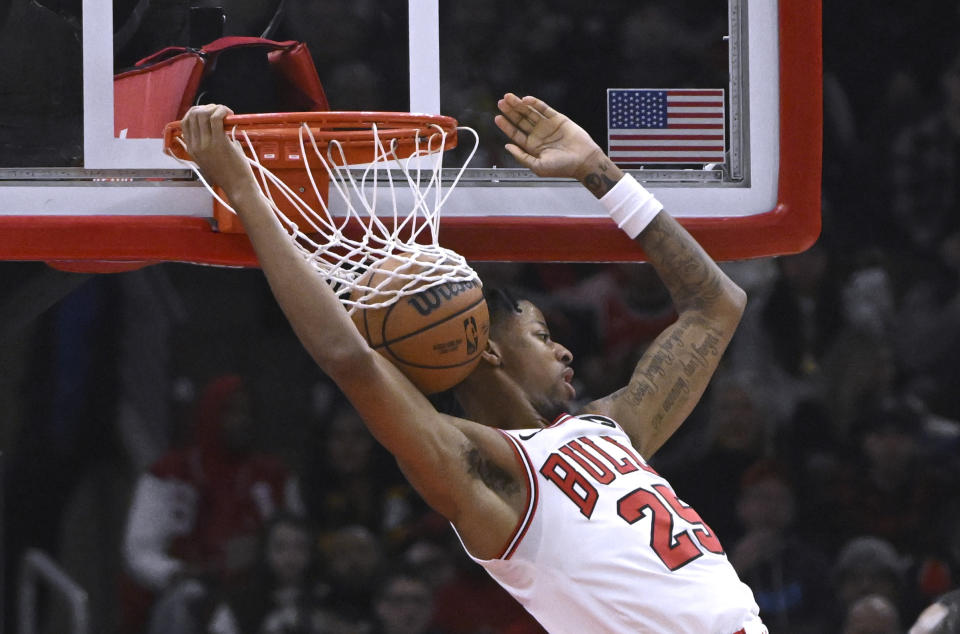 Chicago Bulls forward Dalen Terry dunks against the Cleveland Cavaliers during the first half of an NBA basketball game, Saturday, Dec. 23, 2023, in Chicago. (AP Photo/Matt Marton)