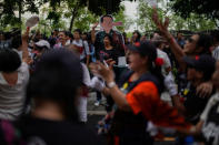 Anti-government protesters gather near a cardboard cut-out mocking Thailand's Prime Minister Prayuth Chan-o-cha as Pinocchio during a protest to demand that the military government hold a general election by November, in Bangkok, Thailand, May 22, 2018. REUTERS/Athit Perawongmetha