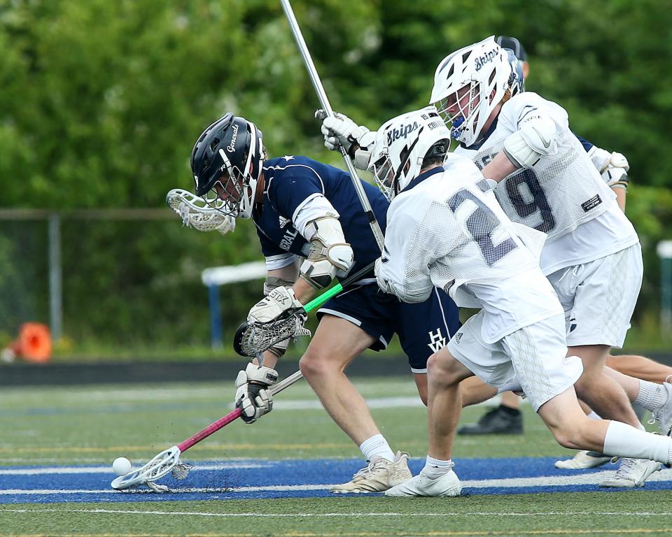 Hamilton-Wenham's William Moroney looks to pick up the gronudball after the face-off draw during second quarter action of their game in the Sweet 16 round of the Division 4 state tournament at Cohasset High School on Saturday, June 11, 2022. 