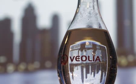 A bottle of water with the logo of Veolia Environnement is seen during the company's 2014 annual results presentation in Paris February 26, 2015. REUTERS/Christian Hartmann (