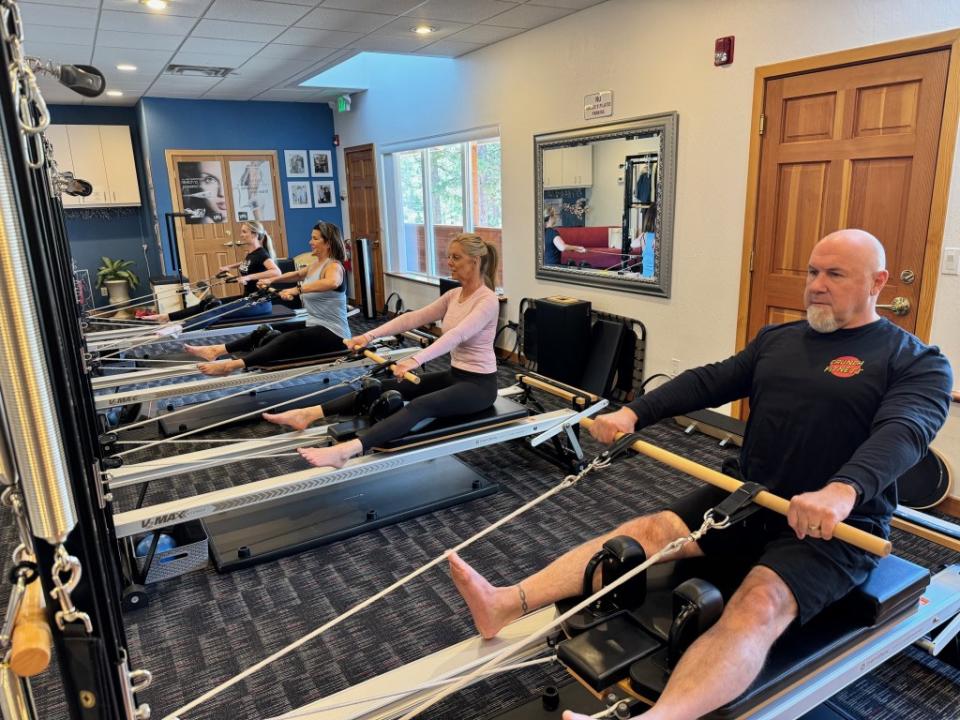 Crunch Fitness CEO does pilates with his wife
