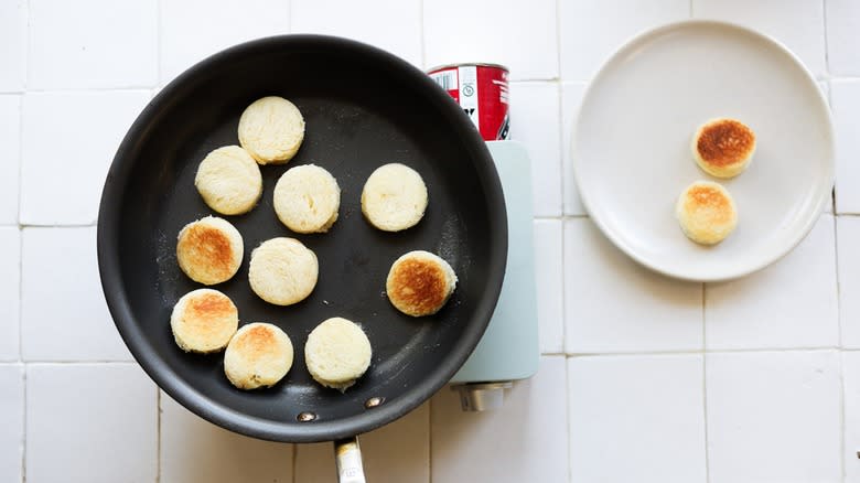 Toasting brioche rounds in pan