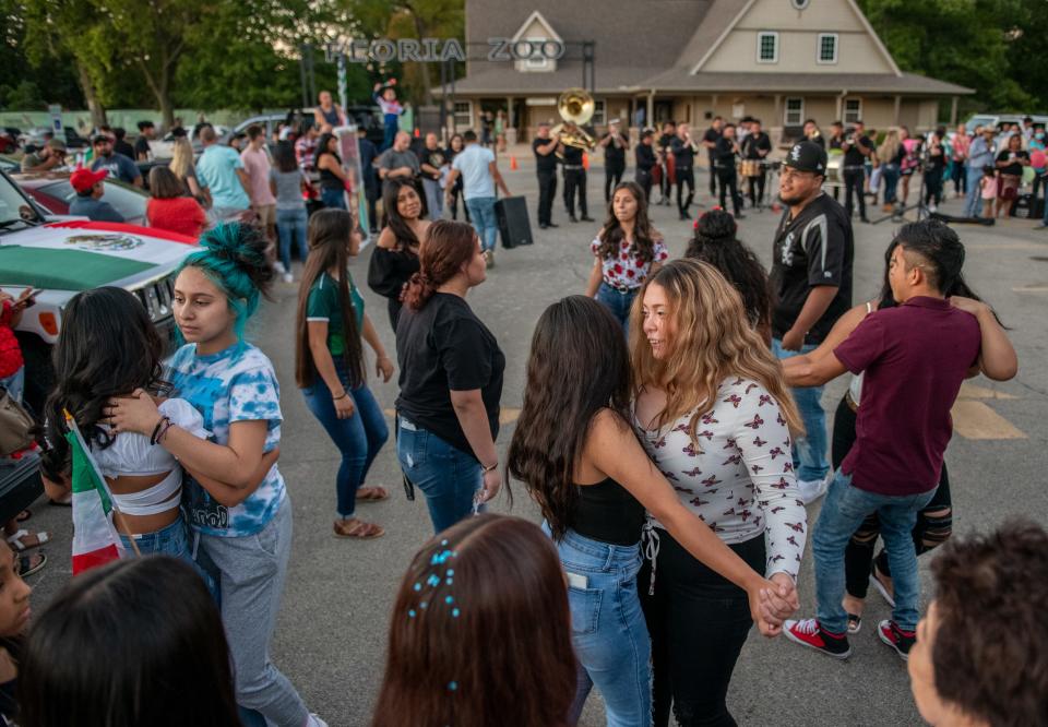 Revelers dance to the sound of a Mexican band during a celebration of Mexican Independence Day on Wednesday, Sept. 15, 2021 at Glen Oak Park.