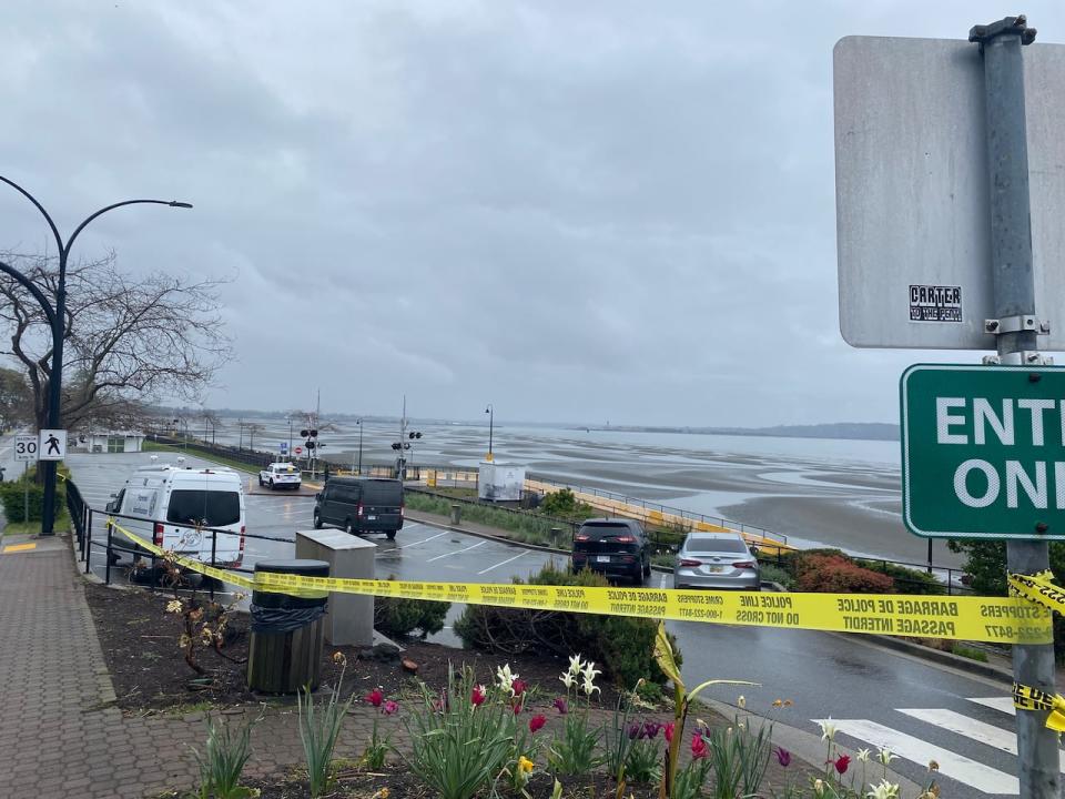 Police tape marks the location along the White Rock promenade where Kulwinder Sohi was stabbed and killed by an unknown perptrator Tuesday night.