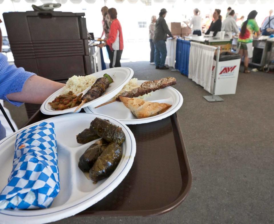 Enjoy Greek food, such as dolmathes (stuffed grape leaves), center, at the Greek Food Festival.