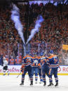 Edmonton Oilers' Evander Kane (91) celebrates a goal against the Los Angeles Kings with Darnell Nurse (25), Connor McDavid (97) and Mattias Ekholm (14) during the third period of Game 2 in an NHL hockey Stanley Cup first-round playoff series Wednesday, April 19, 2023, in Edmonton, Alberta. (Jason Franson/The Canadian Press via AP)