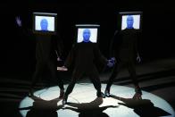 <p>The Blue Man Group perform on stage at the Shrine Auditorium.</p>