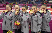 <p>Jordyn Wieber, Gabby Douglas, McKayla Maroney, Alexandra Raisman and Kyla Ross on the podium during the medal ceremony after winning the gold medal during the women’s team final. (Christopher Morris/Corbis via Getty Images) </p>