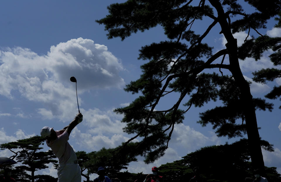 Hideki Matsuyama of Japan watches his tee shot on the 11th hole during the third round of the men's golf event at the 2020 Summer Olympics on Saturday, July 31, 2021, in Kawagoe, Japan. (AP Photo/Matt York)