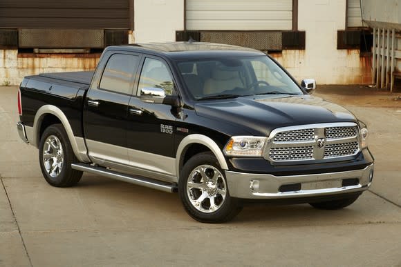 A black and gold 2014 Ram 1500 EcoDiesel, a full-size pickup powered by a diesel engine.