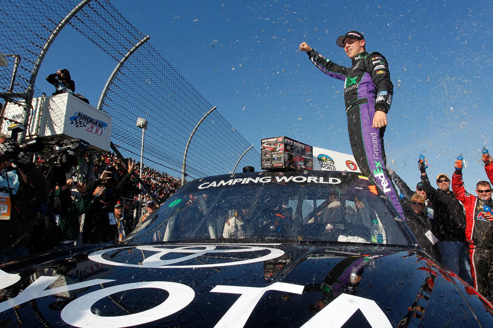 MARTINSVILLE, VA - OCTOBER 29: Denny Hamlin, driver of the #18 Toyota/Traxxas Toyota, celebrates after winning the NASCAR Camping World Truck Series Kroger 200 at Martinsville Speedway on October 29, 2011 in Martinsville, Virginia. (Photo by Geoff Burke/Getty Images for NASCAR)