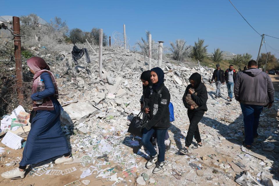 Palestinians leave their damaged homes on the southern outskirts of Khan Yunis towards Rafah further south in the Gaza Strip on Jan. 16, 2024, amid continuing fighting between Israel and the Palestinian militant group Hamas.