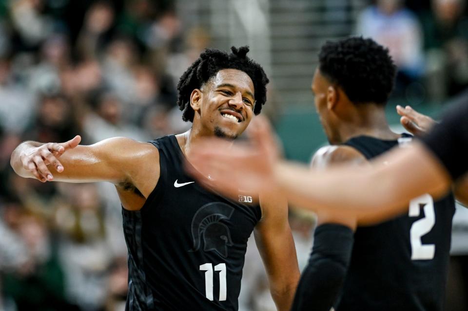 Michigan State's A.J. Hoggard, left, celebrates with Tyson Walker late during the second half in the game against Illinois on Saturday, Feb. 10, 2024, at the Breslin Center in East Lansing.